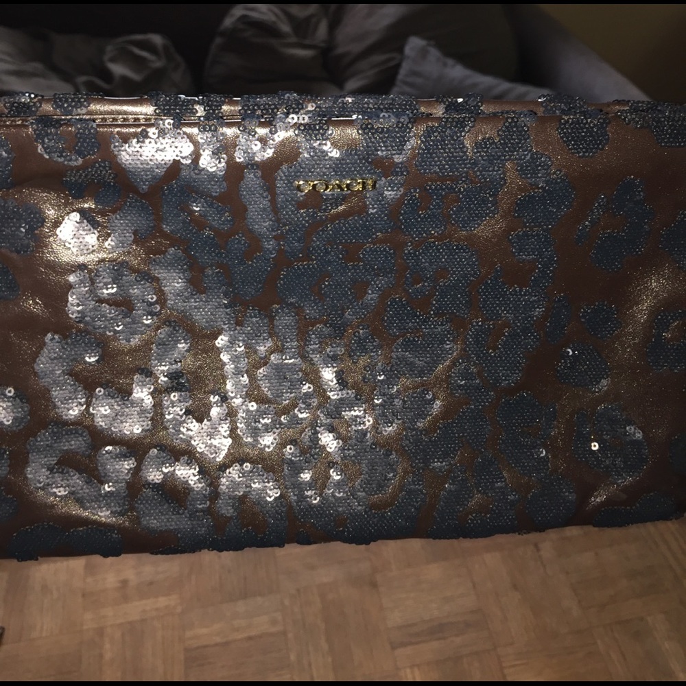 COPY - Coach extra large sequin leopard wristlet/…
